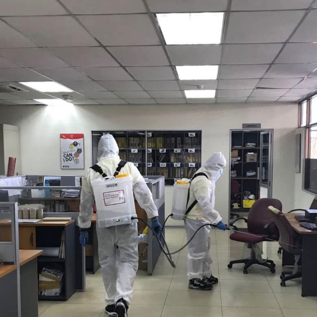Technicians in clean room attire.